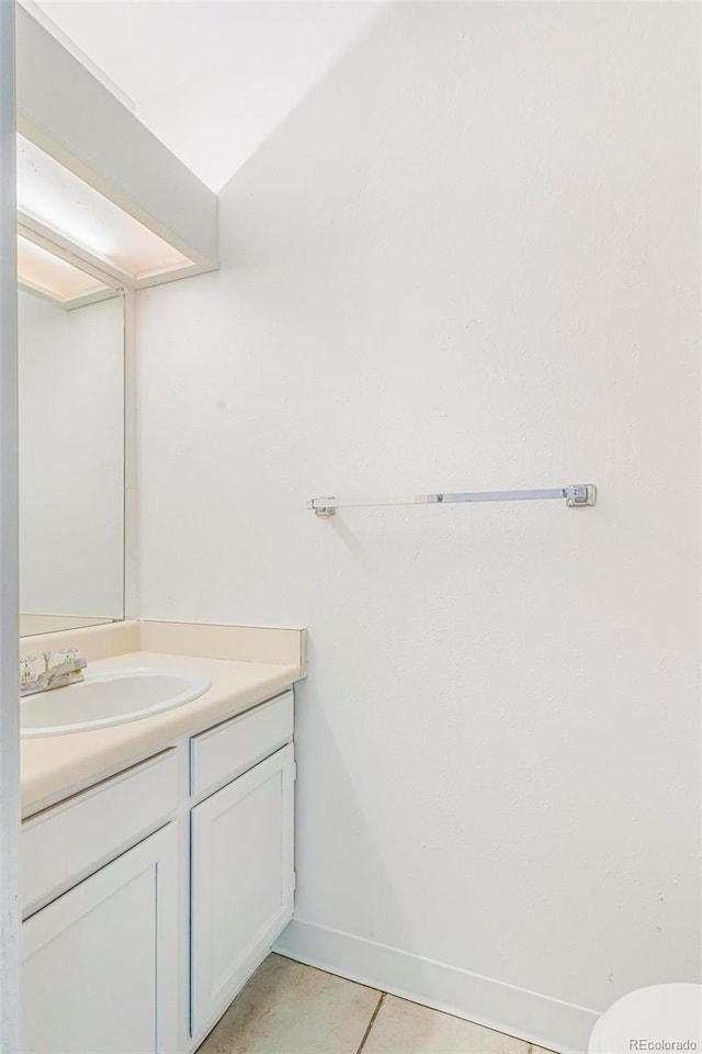72 S Nome St, Aurora, CO 80012 - bathroom with vanity and tile patterned floors