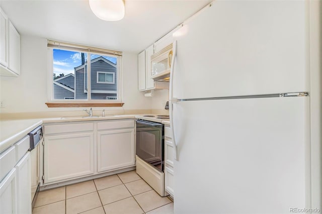 72 S Nome St, Aurora, CO 80012 - kitchen featuring white appliances, white cabinets, light tile patterned floors, and light countertops