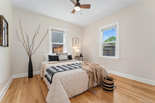 1691 Roslyn St, Denver, CO 80220 - bedroom with light wood-style flooring, baseboards, and ceiling fan