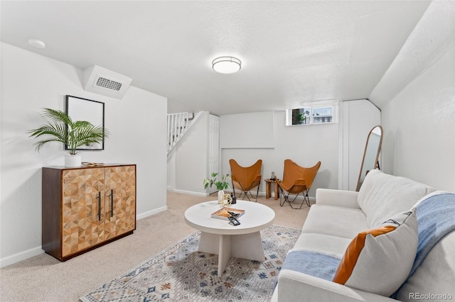 1691 Roslyn St, Denver, CO 80220 - living area featuring carpet, stairs, and baseboards