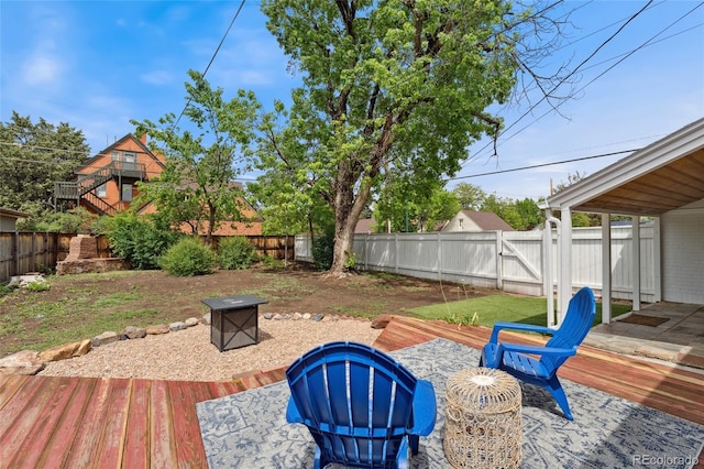 1691 Roslyn St, Denver, CO 80220 - fenced backyard with a fire pit and a wooden deck