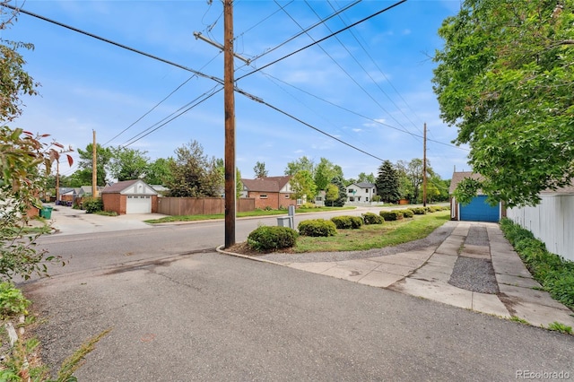 1691 Roslyn St, Denver, CO 80220 - view of asphalt road featuring a residential view