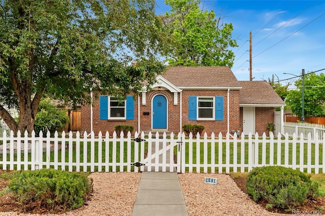 1691 Roslyn St, Denver, CO 80220 - view of front facade featuring brick siding, a gate, and roof with shingles