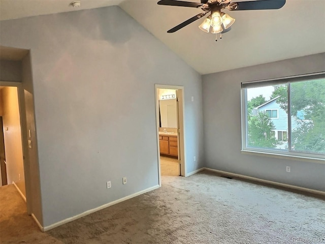 13313 Elizabeth St, Thornton, CO 80241 - unfurnished bedroom featuring light carpet, vaulted ceiling, connected bathroom, and ceiling fan
