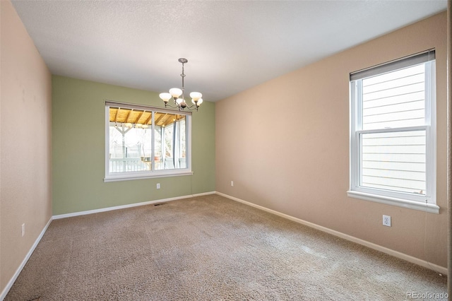 13313 Elizabeth St, Thornton, CO 80241 - unfurnished room with carpet floors and a chandelier