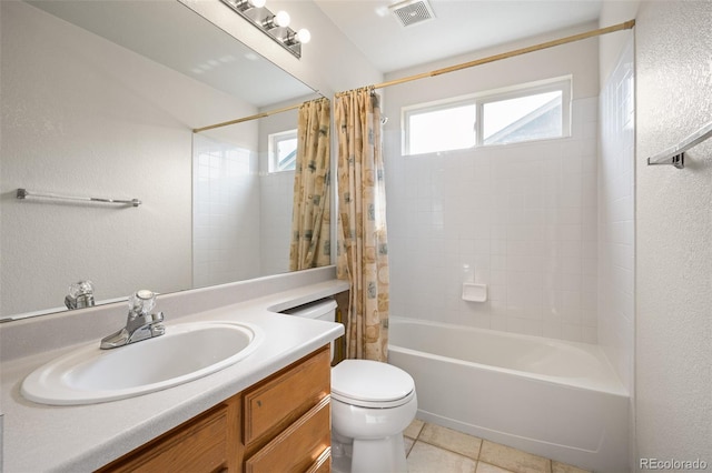 13313 Elizabeth St, Thornton, CO 80241 - full bath with vanity, shower / bath combo with shower curtain, a textured wall, and tile patterned floors