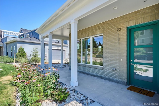 888 S Valentia St Unit 20-101, Denver, CO 80247 - property entrance featuring brick siding and a porch