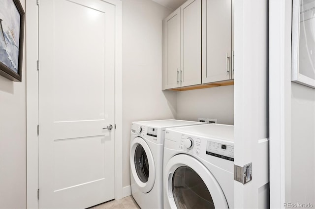 888 S Valentia St Unit 20-101, Denver, CO 80247 - laundry room featuring cabinet space and washer and dryer