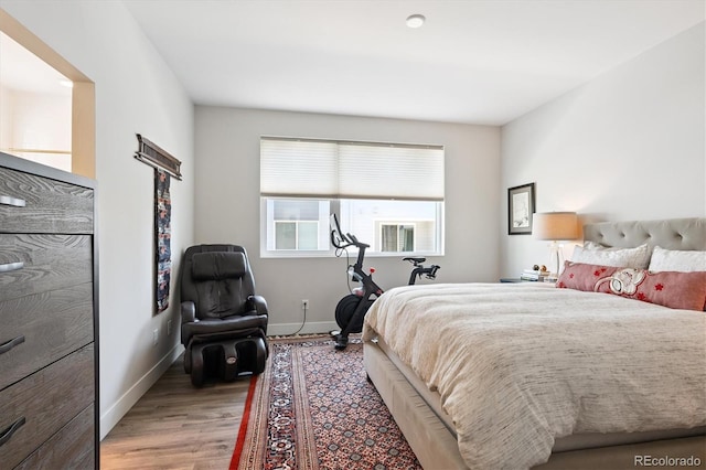 888 S Valentia St Unit 20-101, Denver, CO 80247 - bedroom featuring light wood finished floors and baseboards