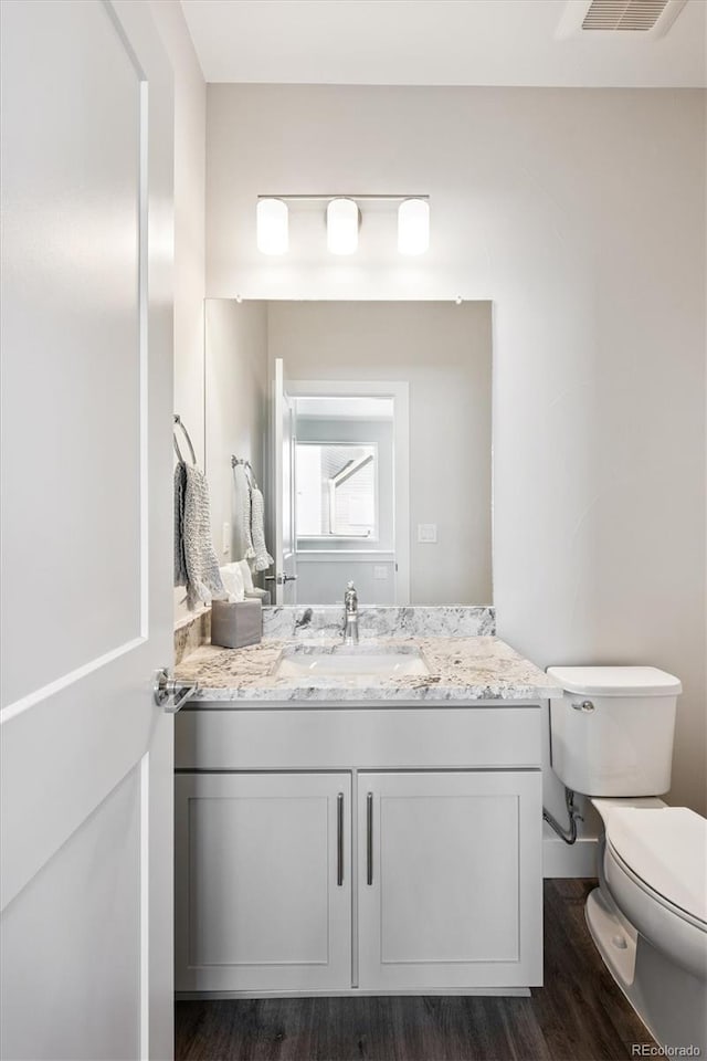 888 S Valentia St Unit 20-101, Denver, CO 80247 - bathroom with vanity and wood finished floors