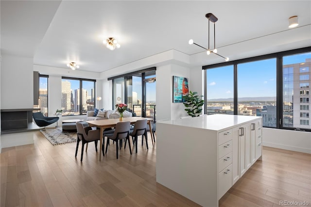 1750 Wewatta St Unit 1720, Denver, CO 80202 - dining room featuring light wood-type flooring and a city view