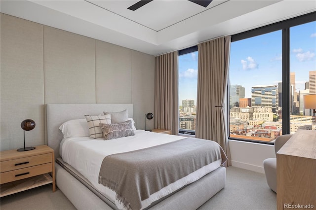 1750 Wewatta St Unit 1720, Denver, CO 80202 - bedroom featuring a view of city, light colored carpet, and baseboards