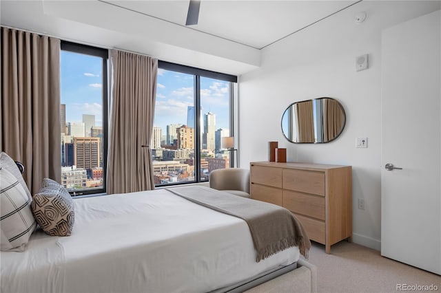1750 Wewatta St Unit 1720, Denver, CO 80202 - bedroom with a skyline view, light carpet, and multiple windows