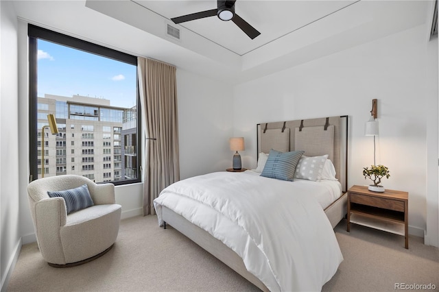 1750 Wewatta St Unit 1720, Denver, CO 80202 - bedroom featuring carpet, baseboards, a tray ceiling, and a ceiling fan