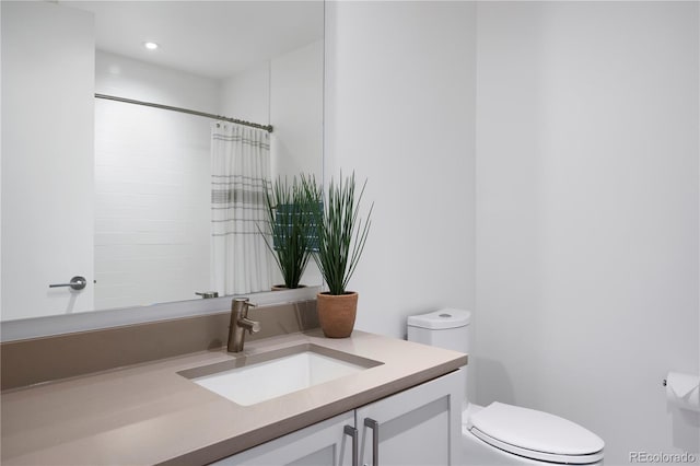 1750 Wewatta St Unit 1720, Denver, CO 80202 - bathroom featuring toilet, vanity, and a shower with curtain
