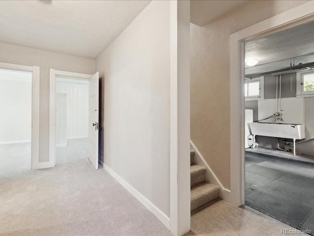 stairway with carpet flooring and baseboards