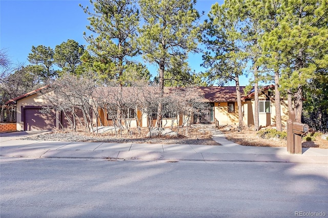 view of front of property featuring a garage