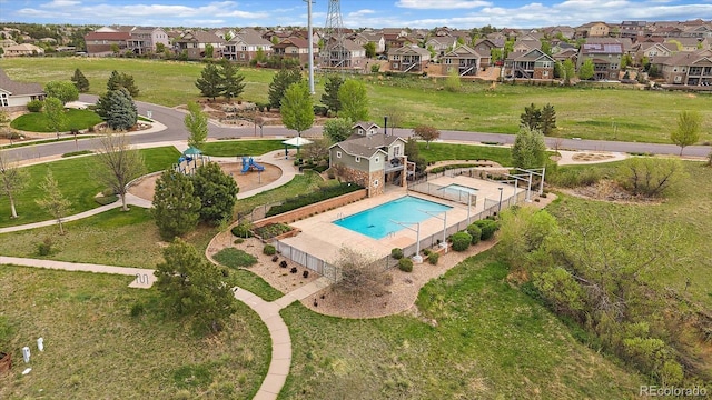aerial perspective of suburban area with a pool area