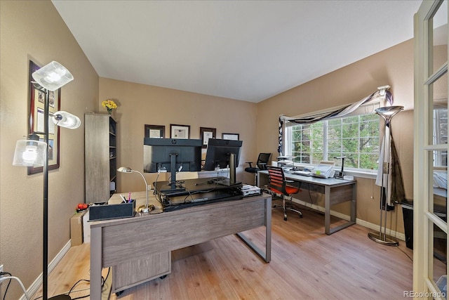 home office with wood finished floors and baseboards