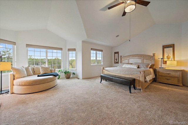 bedroom with light carpet, ceiling fan, baseboards, and high vaulted ceiling