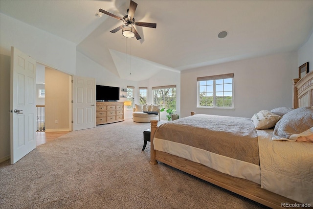 bedroom featuring carpet floors, vaulted ceiling, baseboards, and a ceiling fan