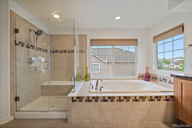 full bathroom with a shower stall, a garden tub, tile patterned floors, and recessed lighting