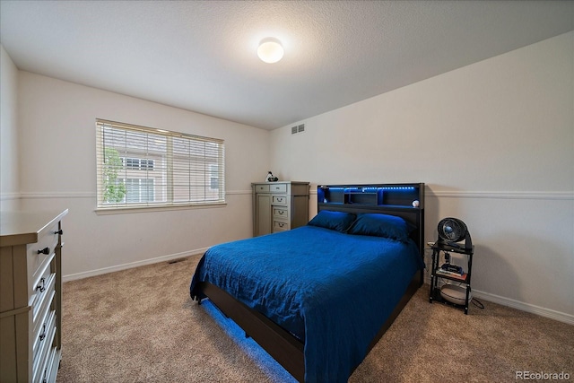 bedroom featuring carpet flooring and baseboards