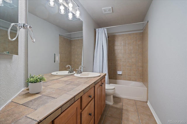 full bathroom with tile patterned flooring, toilet, shower / bathtub combination with curtain, vanity, and baseboards