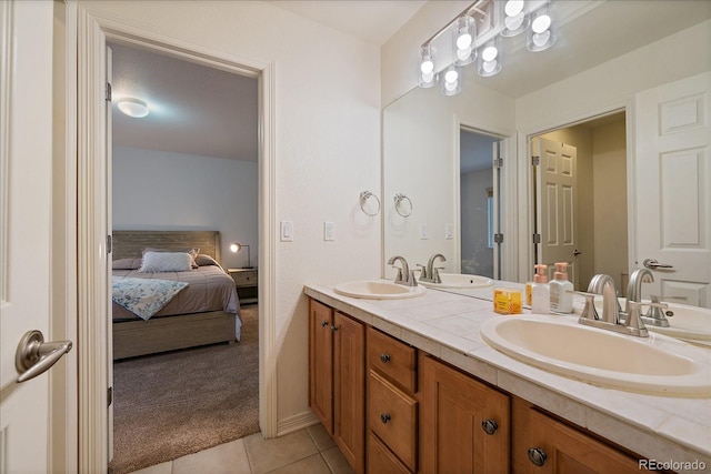 full bathroom featuring tile patterned flooring, connected bathroom, and double vanity