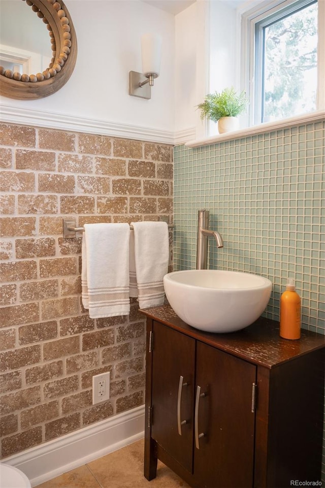 half bathroom featuring vanity and tile patterned floors