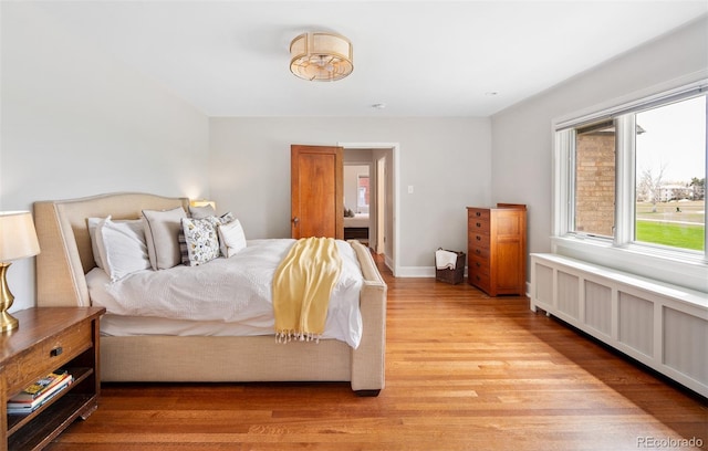 bedroom with light wood-style flooring