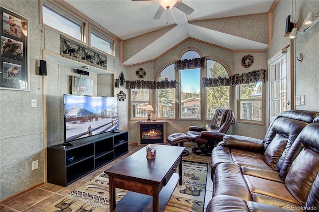 living room with tile patterned flooring, ceiling fan, and lofted ceiling