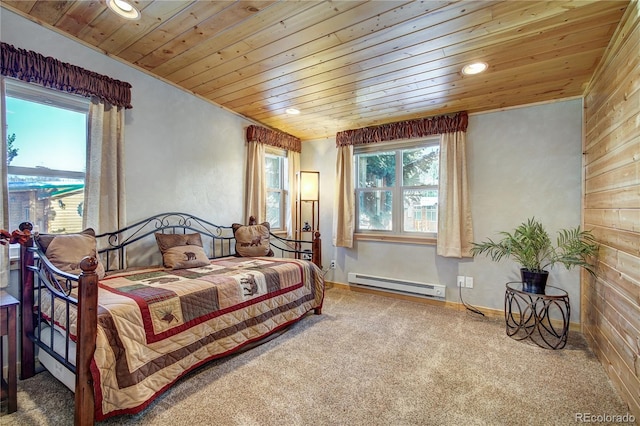 carpeted bedroom featuring a baseboard radiator, wooden walls, and wood ceiling