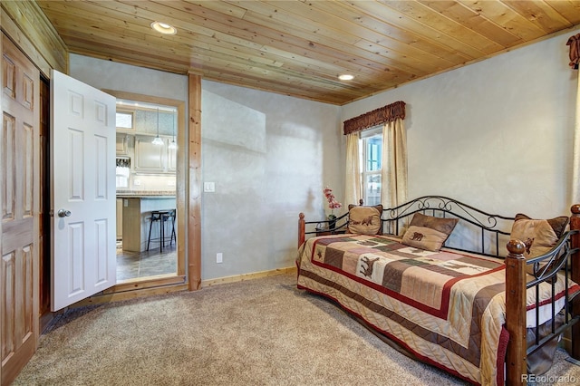 carpeted bedroom featuring wooden ceiling