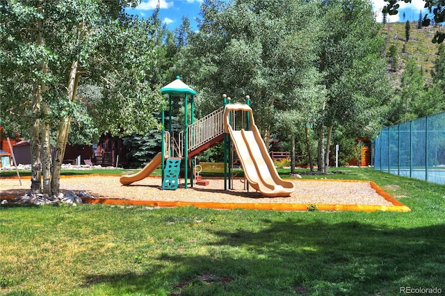 view of jungle gym featuring a yard