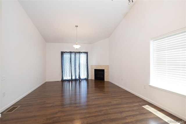 unfurnished living room with dark hardwood / wood-style flooring