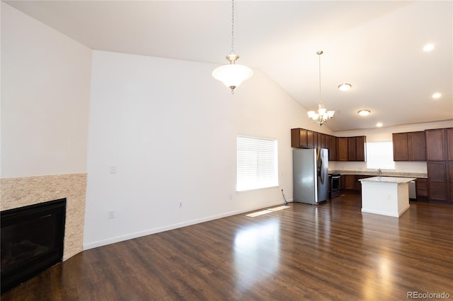 kitchen featuring plenty of natural light, a kitchen island, dark hardwood / wood-style flooring, and stainless steel appliances