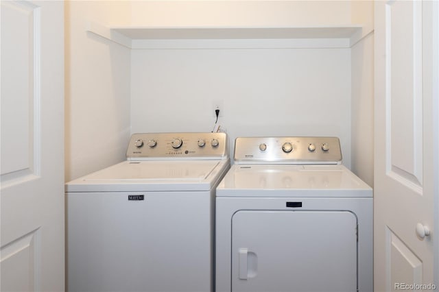 washroom with separate washer and dryer