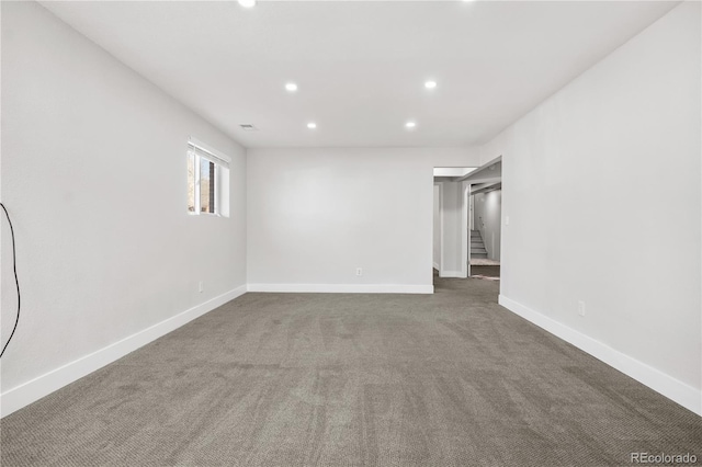 carpeted spare room with visible vents, stairway, recessed lighting, and baseboards