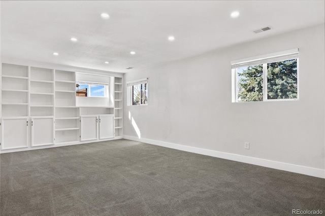 interior space with recessed lighting, visible vents, dark carpet, and baseboards