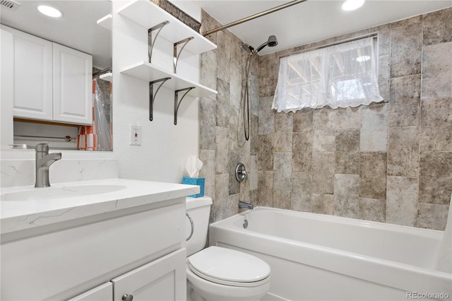 bathroom with vanity,  shower combination, toilet, and recessed lighting