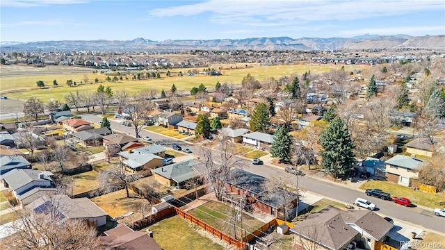 birds eye view of property featuring a mountain view and a residential view