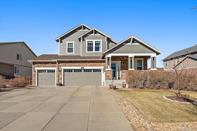 craftsman inspired home with roof with shingles, covered porch, concrete driveway, a garage, and stone siding