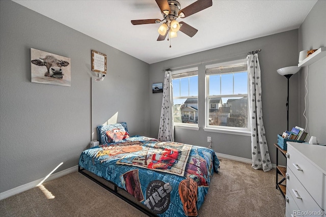 bedroom featuring carpet floors, a ceiling fan, and baseboards