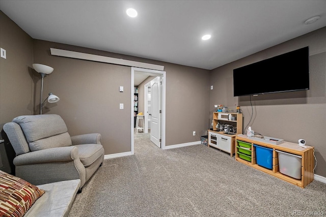 carpeted living area featuring recessed lighting and baseboards