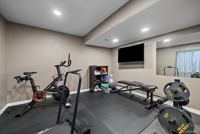 exercise room with recessed lighting, visible vents, and baseboards