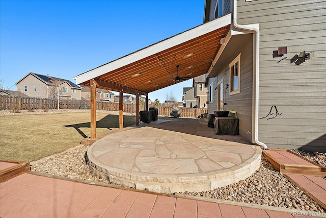 view of patio / terrace featuring a fenced backyard and a residential view