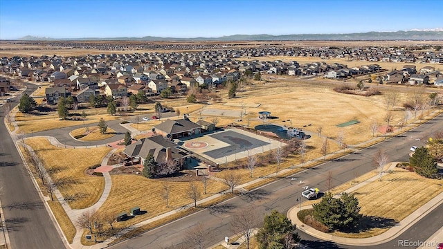 birds eye view of property with a mountain view and a residential view