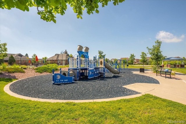 community jungle gym with a lawn