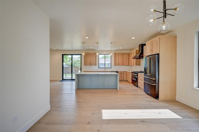 717 Marquette Ave, Buena Vista, CO 81211 - kitchen featuring wall chimney exhaust hood, high quality appliances, light countertops, decorative backsplash, and a kitchen island